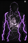 Hoodie with a graphic design of a person with a mask and 'mystery girl' text, illuminated by white lightning effects on a black background.